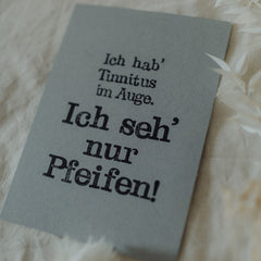 Postkarte "Tinnitus im Auge" gestempelter Spruch