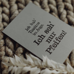 Postkarte "Tinnitus im Auge" gestempelter Spruch