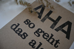 Postkarte "Aha" gestempelter Spruch