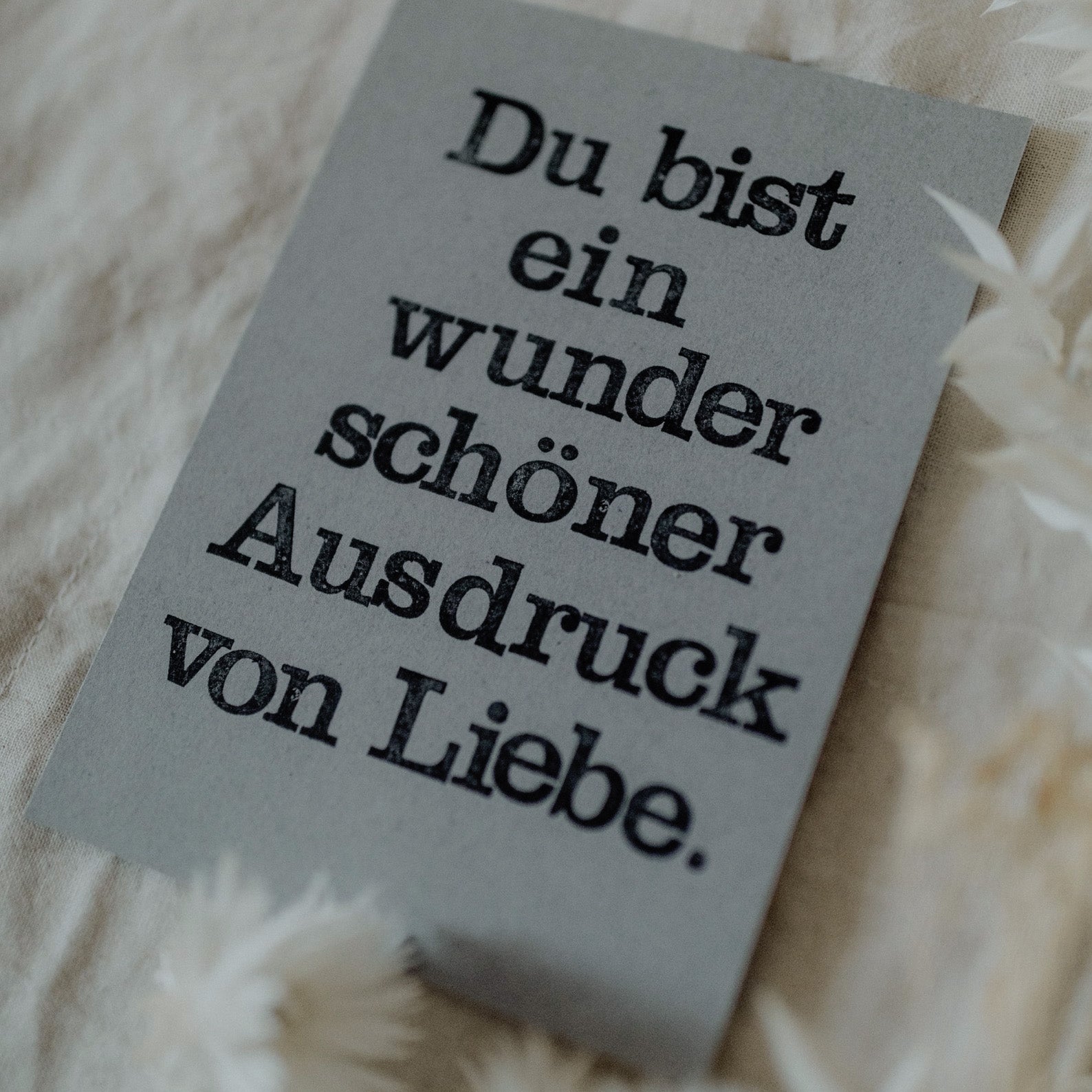 Postkarte "Ausdruck von Liebe" gestempelter Spruch